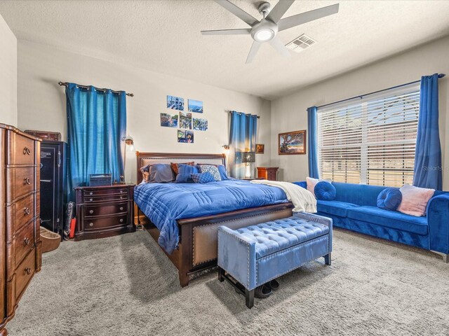1319 Johns Cove Ln, Oakland, FL 34787 - carpeted bedroom featuring a textured ceiling and a ceiling fan
