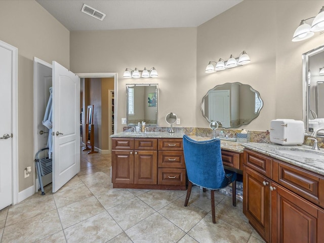 1319 Johns Cove Ln, Oakland, FL 34787 - bathroom featuring double vanity and tile patterned flooring