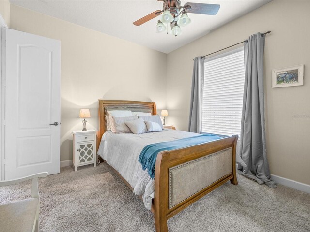 1319 Johns Cove Ln, Oakland, FL 34787 - bedroom featuring carpet floors, baseboards, and a ceiling fan