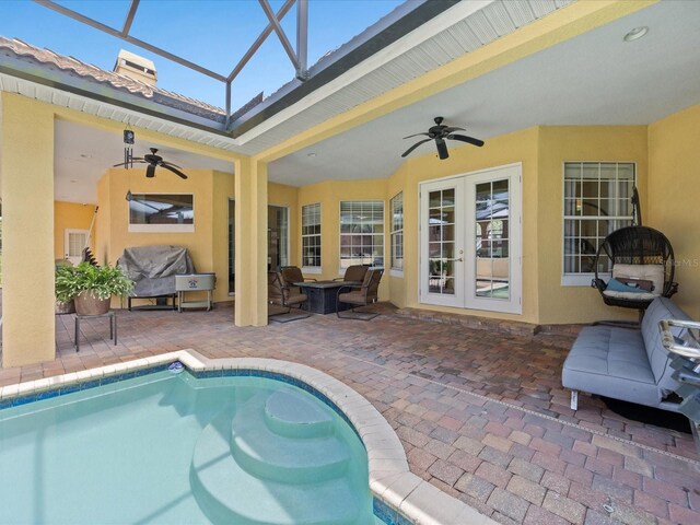 1319 Johns Cove Ln, Oakland, FL 34787 - outdoor pool with a ceiling fan, french doors, a patio, and glass enclosure