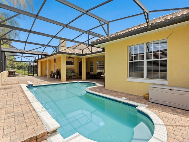 1319 Johns Cove Ln, Oakland, FL 34787 - outdoor pool featuring a patio area, a ceiling fan, and glass enclosure
