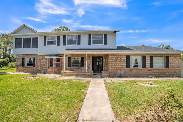 1601 Randolph St, Deltona, FL 32725 - view of front of property featuring brick siding, a front lawn, covered porch, and stucco siding