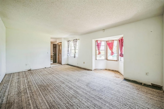 1601 Randolph St, Deltona, FL 32725 - empty room featuring a textured ceiling and carpet floors