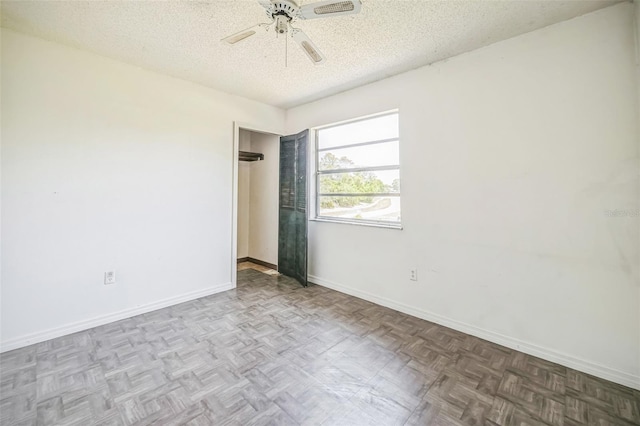 1601 Randolph St, Deltona, FL 32725 - empty room featuring a textured ceiling, a ceiling fan, and baseboards