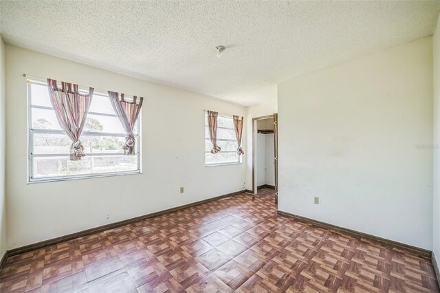 1601 Randolph St, Deltona, FL 32725 - unfurnished room featuring a textured ceiling and baseboards