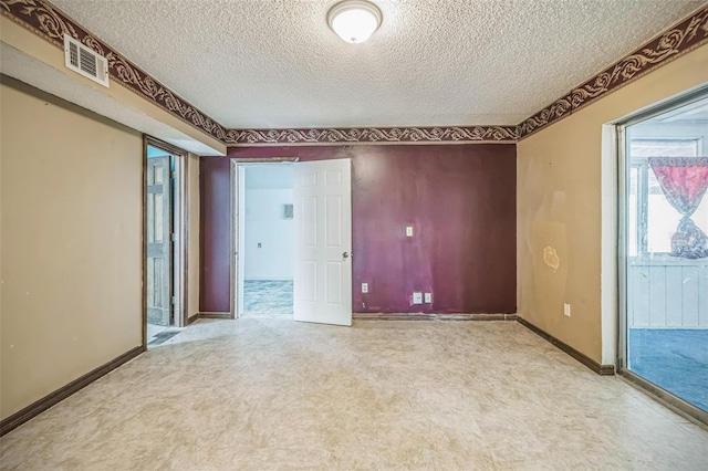 1601 Randolph St, Deltona, FL 32725 - unfurnished room featuring a textured ceiling, light flooring, and baseboards