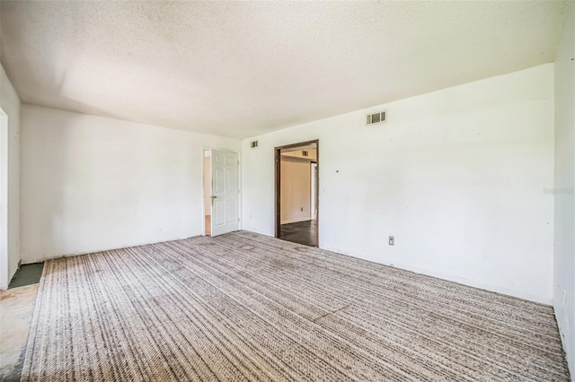 1601 Randolph St, Deltona, FL 32725 - spare room featuring a textured ceiling and carpet floors