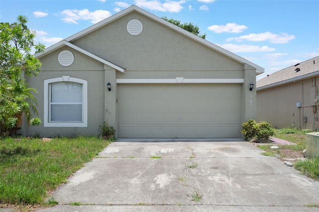 8141 Golden Chickasaw Cir, Orlando, FL 32825 - view of front facade featuring driveway, a garage, and stucco siding