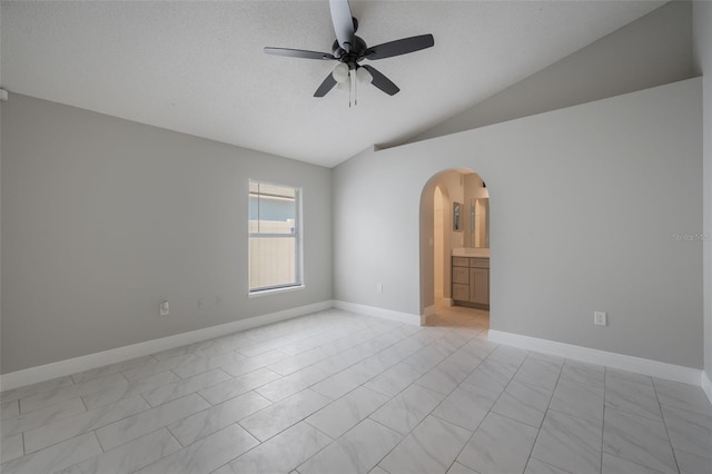 8141 Golden Chickasaw Cir, Orlando, FL 32825 - unfurnished room with arched walkways, ceiling fan, vaulted ceiling, baseboards, and a textured ceiling