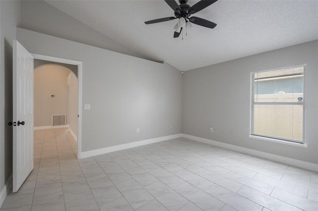 8141 Golden Chickasaw Cir, Orlando, FL 32825 - unfurnished room featuring arched walkways, a ceiling fan, lofted ceiling, and baseboards