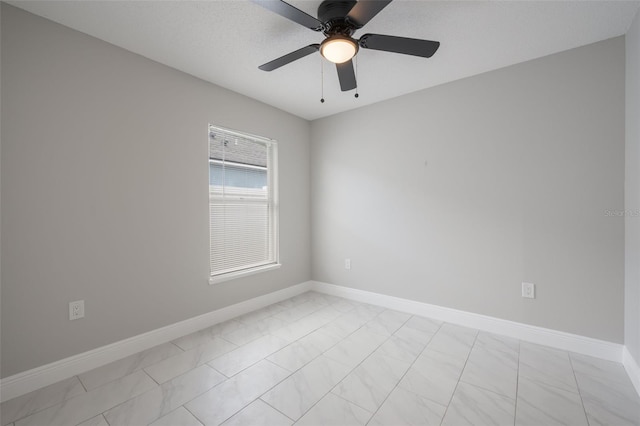 8141 Golden Chickasaw Cir, Orlando, FL 32825 - empty room with baseboards, ceiling fan, and light marble finish floors
