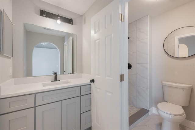 8141 Golden Chickasaw Cir, Orlando, FL 32825 - full bathroom featuring toilet, a stall shower, marble look tiles, vanity, and baseboards
