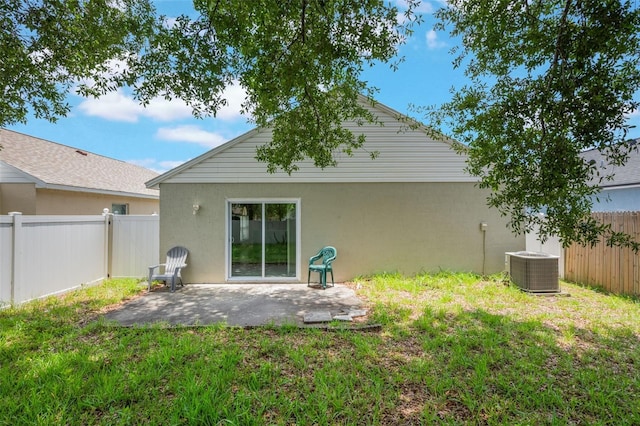8141 Golden Chickasaw Cir, Orlando, FL 32825 - back of house with a patio area, stucco siding, and central air condition unit