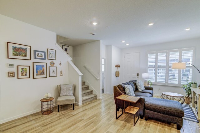 625 Dogfish Ln, Debary, FL 32713 - living room featuring stairs, light wood-type flooring, recessed lighting, and baseboards