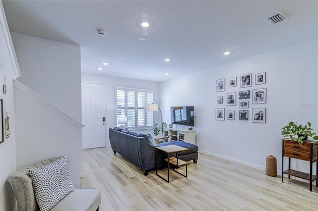 625 Dogfish Ln, Debary, FL 32713 - living area with light wood-type flooring, stairway, recessed lighting, and baseboards
