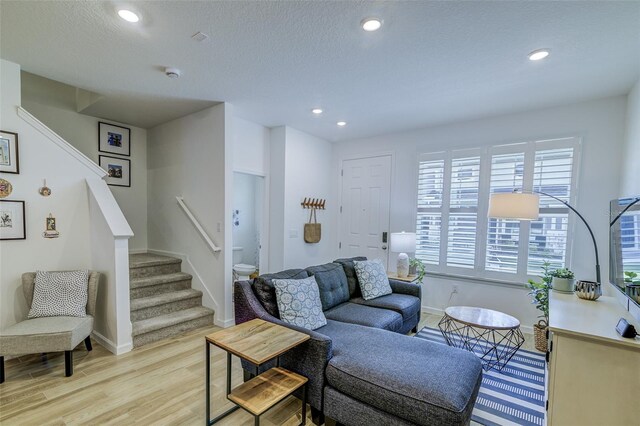 625 Dogfish Ln, Debary, FL 32713 - living room featuring light wood finished floors, stairway, recessed lighting, and baseboards