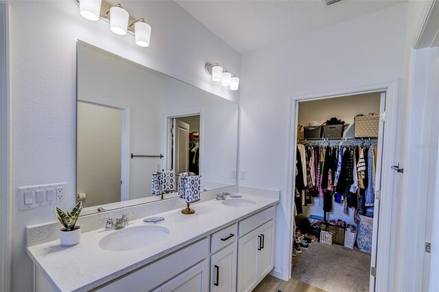 625 Dogfish Ln, Debary, FL 32713 - full bathroom with double vanity and a spacious closet
