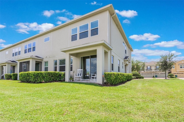 15241 Sunrise Grove Ct, Winter Garden, FL 34787 - rear view of property featuring stucco siding and a lawn