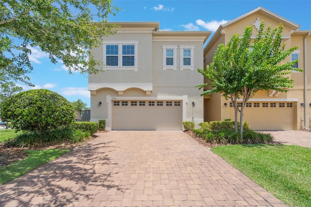 15241 Sunrise Grove Ct, Winter Garden, FL 34787 - view of front of property with decorative driveway and stucco siding
