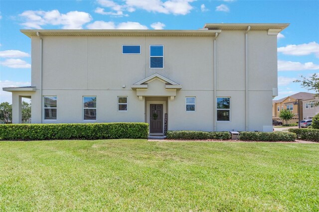 15241 Sunrise Grove Ct, Winter Garden, FL 34787 - view of front of home with a front yard and stucco siding