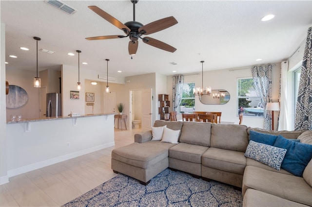 15241 Sunrise Grove Ct, Winter Garden, FL 34787 - living area featuring recessed lighting, a chandelier, ceiling fan, and baseboards