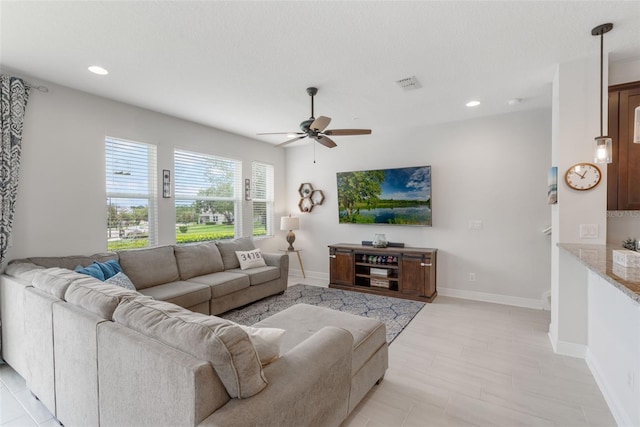 15241 Sunrise Grove Ct, Winter Garden, FL 34787 - living area featuring a ceiling fan, recessed lighting, and baseboards