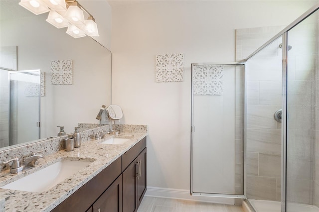 15241 Sunrise Grove Ct, Winter Garden, FL 34787 - bathroom with double vanity, a shower stall, and baseboards