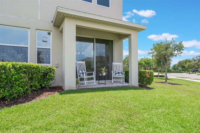 15241 Sunrise Grove Ct, Winter Garden, FL 34787 - property entrance featuring stucco siding and a yard