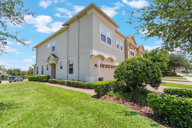 15241 Sunrise Grove Ct, Winter Garden, FL 34787 - view of side of property with a garage, stucco siding, and a lawn