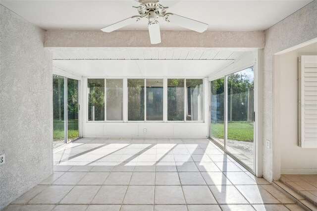 2015 Gardenia Landings Ln, Sun City Center, FL 33573 - unfurnished sunroom with tile patterned flooring and a textured wall