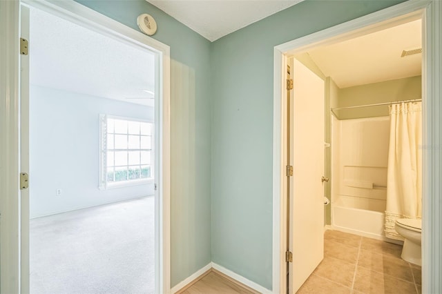 2015 Gardenia Landings Ln, Sun City Center, FL 33573 - corridor featuring light tile patterned floors and baseboards