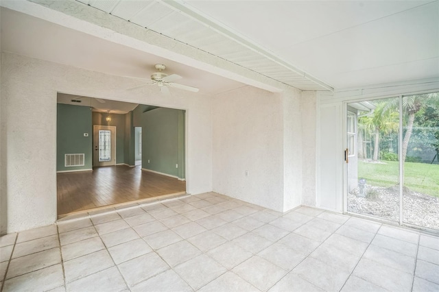 2015 Gardenia Landings Ln, Sun City Center, FL 33573 - unfurnished room with light tile patterned floors and ceiling fan