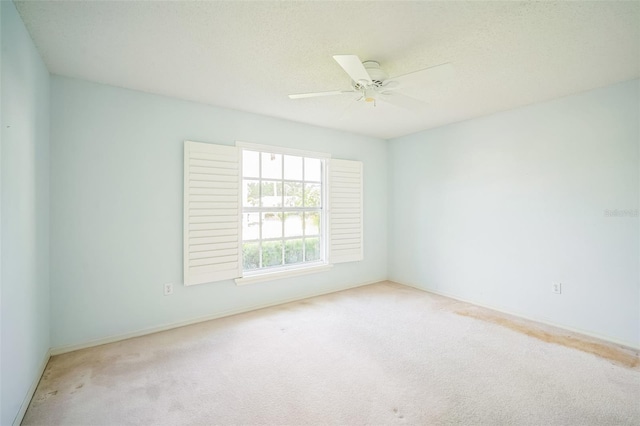 2015 Gardenia Landings Ln, Sun City Center, FL 33573 - spare room with carpet, a ceiling fan, and baseboards