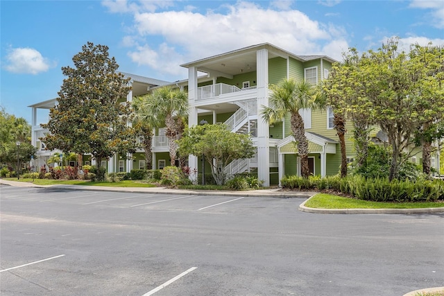 110 Watling Way Unit 25204, Davenport, FL 33837 - view of property with uncovered parking and stairway