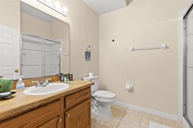 110 Watling Way Unit 25204, Davenport, FL 33837 - full bathroom featuring a shower with shower door, tile patterned flooring, toilet, vanity, and baseboards