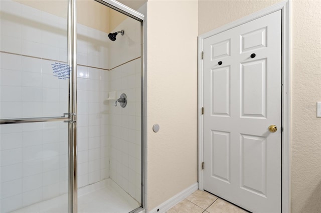 110 Watling Way Unit 25204, Davenport, FL 33837 - full bathroom featuring a shower stall, a textured wall, and tile patterned flooring
