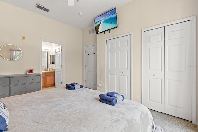 110 Watling Way Unit 25204, Davenport, FL 33837 - bedroom with two closets, ensuite bathroom, and ceiling fan