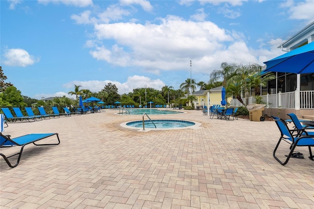 110 Watling Way Unit 25204, Davenport, FL 33837 - community pool featuring a hot tub and a patio area