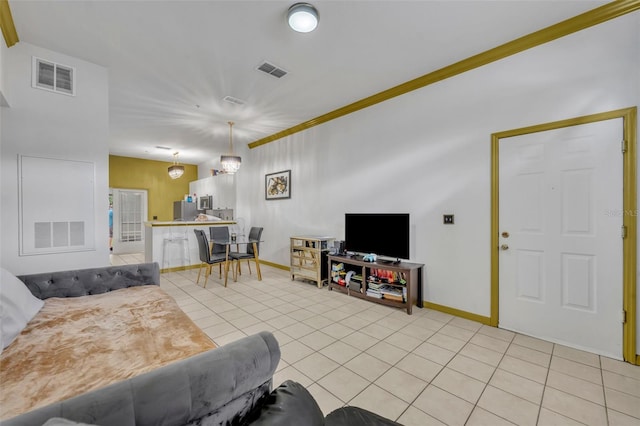 141 Reserve Cir Unit 113, Oviedo, FL 32765 - living room featuring light tile patterned flooring and baseboards