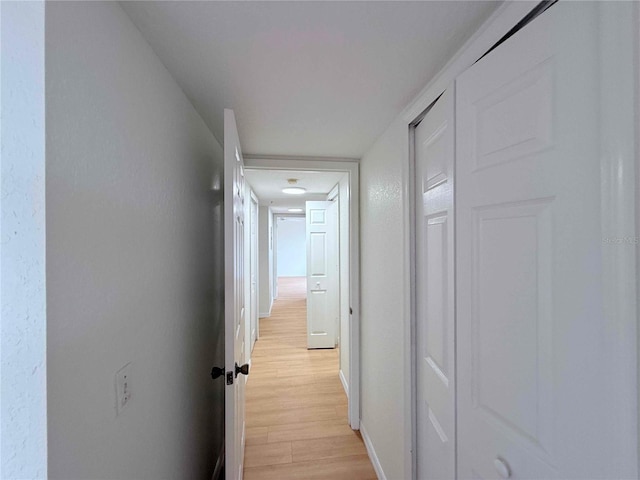 13917 Fairway Island Dr Unit 931, Orlando, FL 32837 - hallway featuring light wood finished floors and baseboards