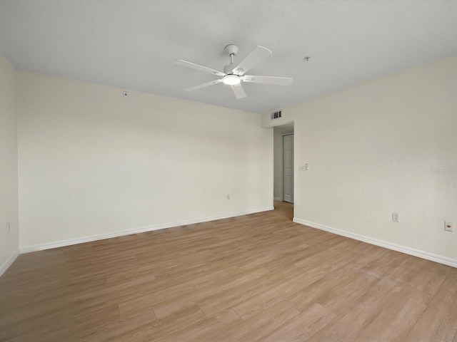 13917 Fairway Island Dr Unit 931, Orlando, FL 32837 - unfurnished room with light wood-style floors, a ceiling fan, baseboards, and fire sprinkler in ceiling