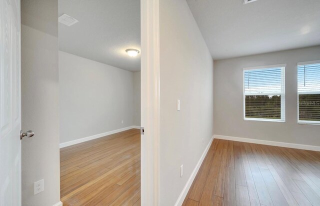 491 Whistling Duck Trl, Saint Cloud, FL 34771 - empty room with hardwood / wood-style flooring and baseboards