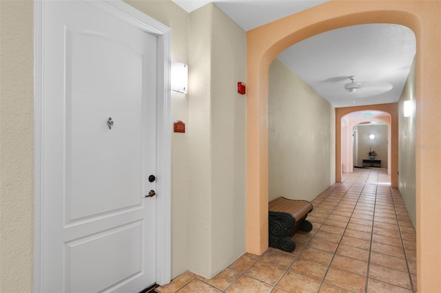 500 Mirasol Cir Unit 203, Celebration, FL 34747 - corridor featuring arched walkways and light tile patterned floors