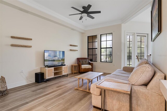 500 Mirasol Cir Unit 203, Celebration, FL 34747 - living room with light wood-type flooring, a ceiling fan, crown molding, and baseboards