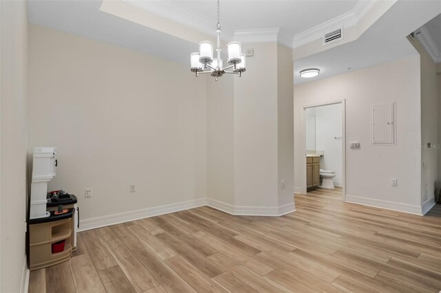 500 Mirasol Cir Unit 203, Celebration, FL 34747 - unfurnished dining area with ornamental molding, a chandelier, light wood-style floors, baseboards, and electric panel