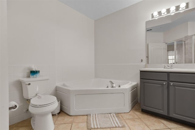 500 Mirasol Cir Unit 203, Celebration, FL 34747 - full bath with tile walls, vanity, a bath, toilet, and tile patterned flooring