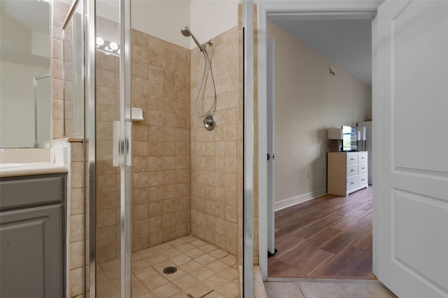 500 Mirasol Cir Unit 203, Celebration, FL 34747 - bathroom with a stall shower, vanity, and wood finished floors