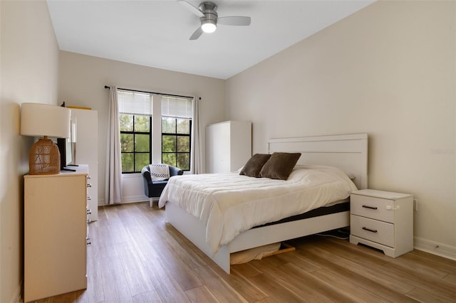 500 Mirasol Cir Unit 203, Celebration, FL 34747 - bedroom featuring light wood-style floors, baseboards, and a ceiling fan