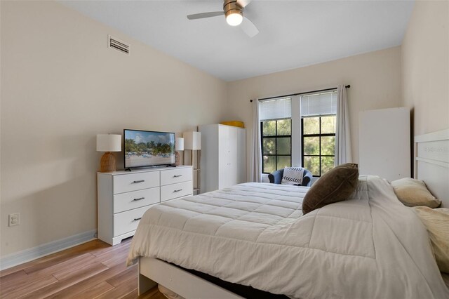 500 Mirasol Cir Unit 203, Celebration, FL 34747 - bedroom with light wood-style floors, baseboards, and ceiling fan