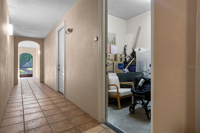 500 Mirasol Cir Unit 203, Celebration, FL 34747 - corridor with a textured wall and arched walkways